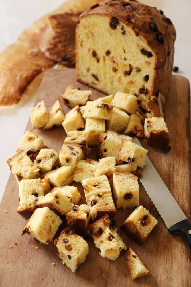 panettone cut into cubes on a cutting board.