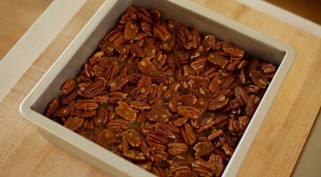 Overhead shot of brownie pan filled with pecan bar filling mixture