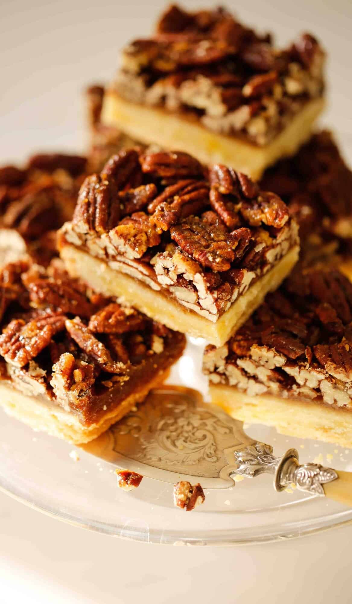 pecan bars on a cake stand