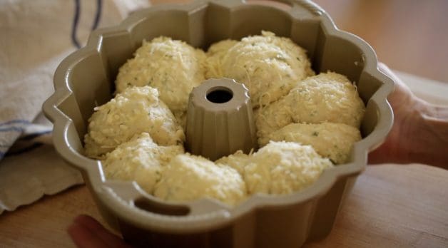 Dough balls have risen for a second time in a bundt pan