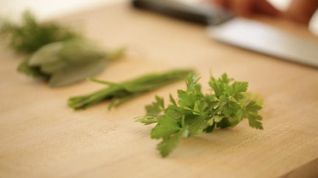 fresh herbs on cutting board