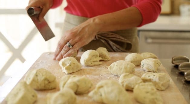 Cutting 16 dough balls on a cutting board