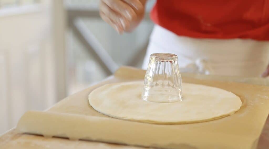 a glass placed in the center of a puff pastry round