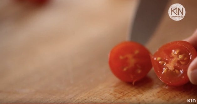 Cherry tomato cut in half revealing the interior seeds