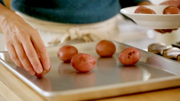 Red potatoes on a baking sheet