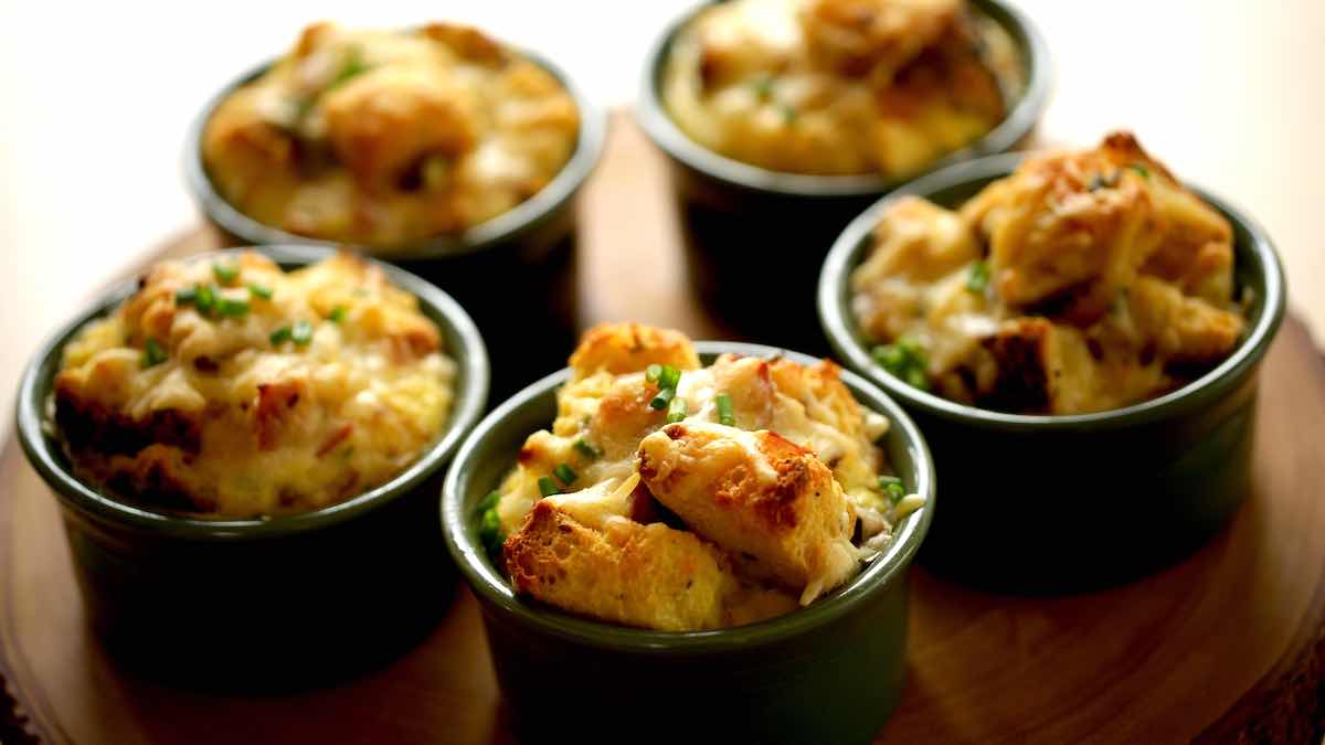 A group of green ramekins with egg casseroles inside