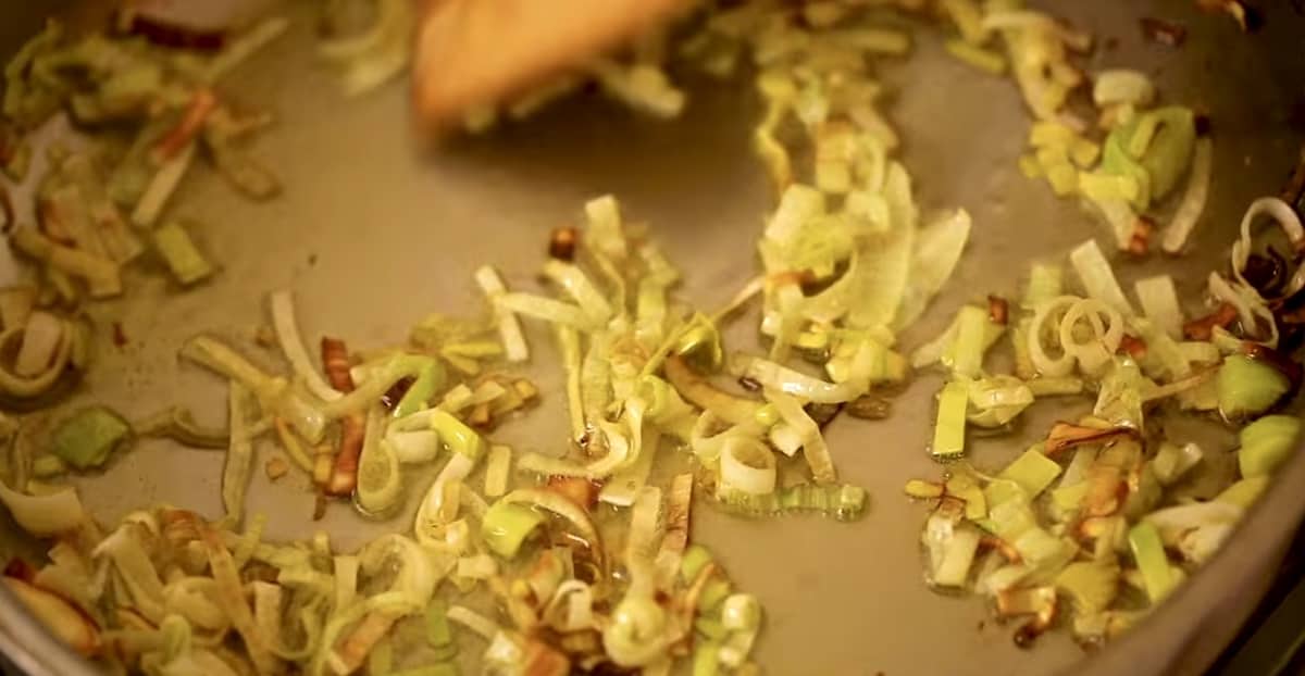 leeks sauted and crispy in a skillet