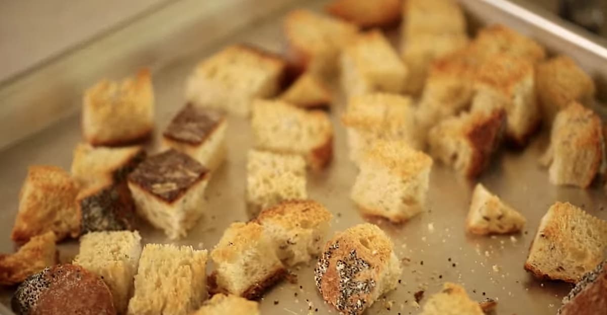 bread cubes toasted on a sheet pan
