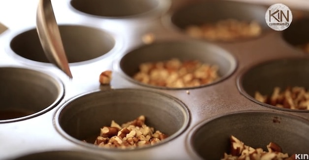 Pecans in muffin well for sticky bun recipe