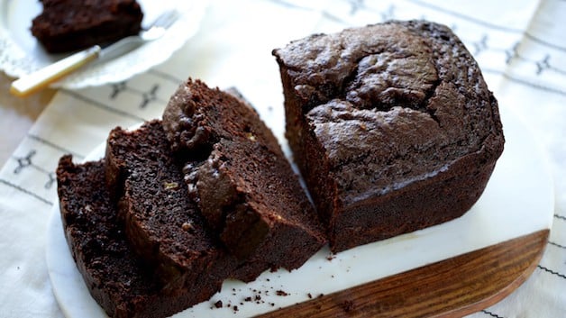 Chocolate Banana Bread sliced on a white marble cutting board