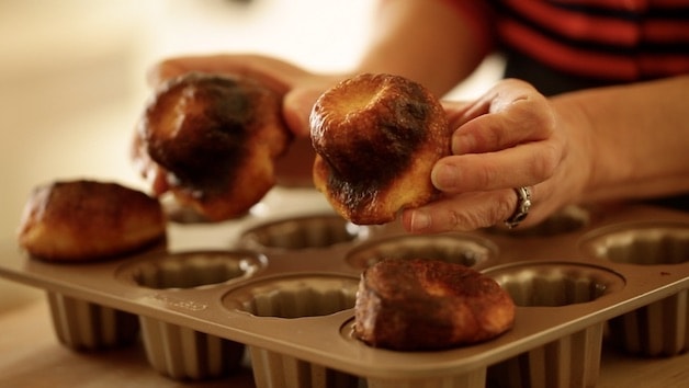 Removing poorly baked caneles from a pan where the batter was not rested