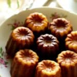 Vertical Image of a Caneles in a floral cake dish