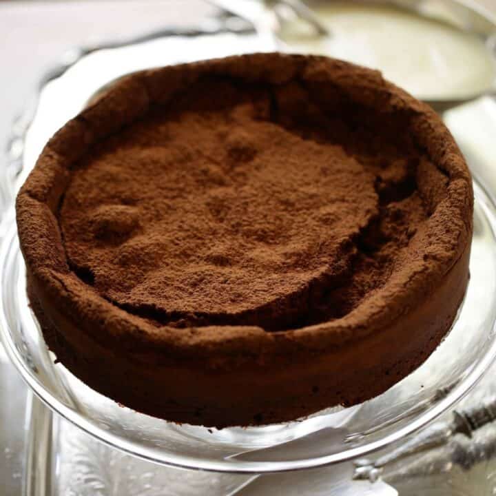 Flourless Chocolate Cake on a glass cake stand