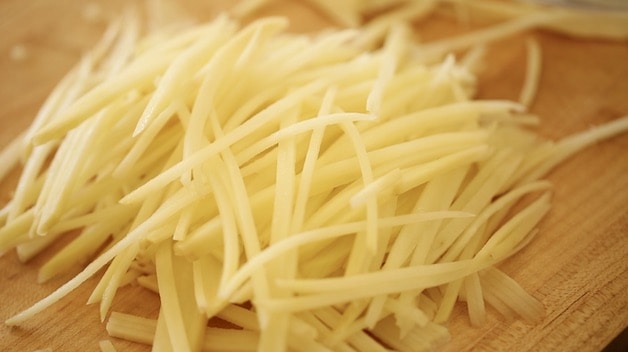 Close up of match stick potatoes ready to fry into french fries