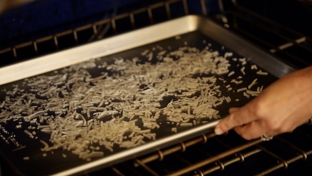 Tosting coconut on a baking sheet in the oven