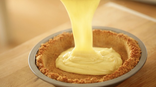 Pouring Pastry Cream into a pie shell for a coconut cream pie