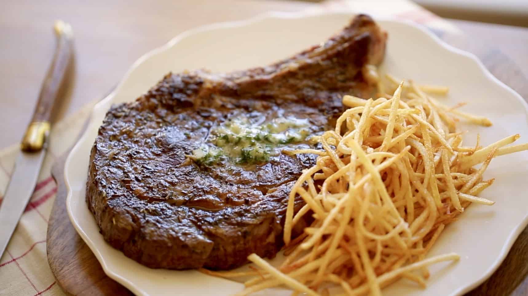 Steak Frites Recipe on a white plate 