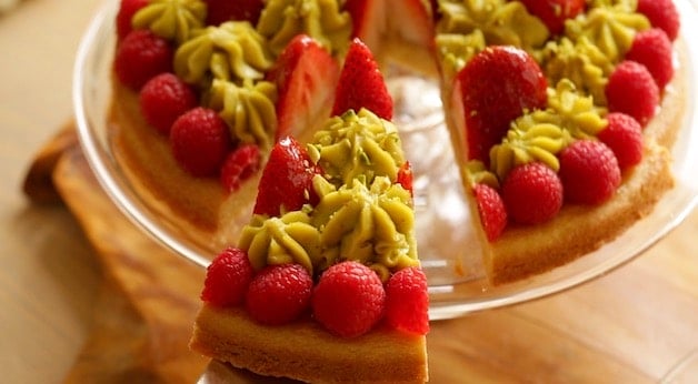 Serving a slice of strawberry pistachio tart