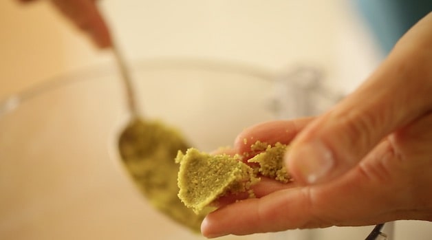 holding a pat of homemade pistachio paste