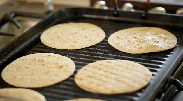 Grilling Corn Tortillas on an indoor grill pan for tacos