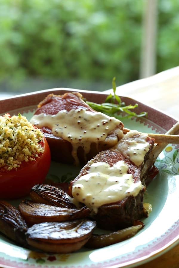 Slow Roasted Lamb Chops with Mustard sauce, carmelized shallots and roasted tomato