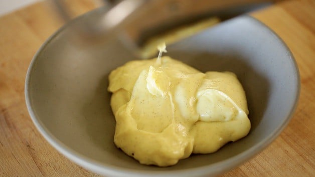 Pastry cream in a small gray bowl