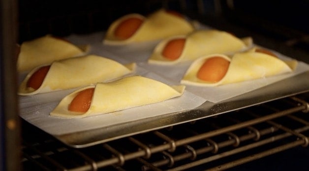 French Apricot Pastries on a baking sheet in the oven