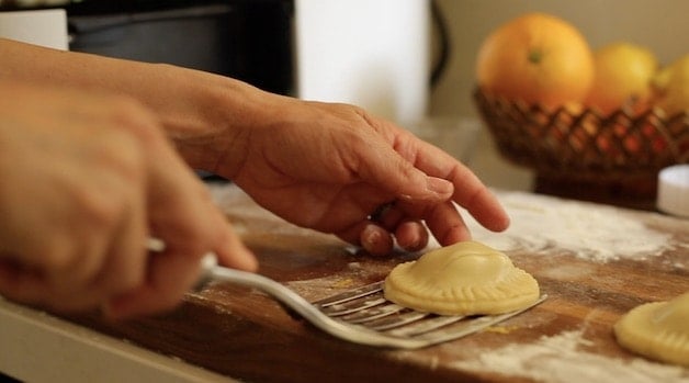 Picking up hand pies with a spatula