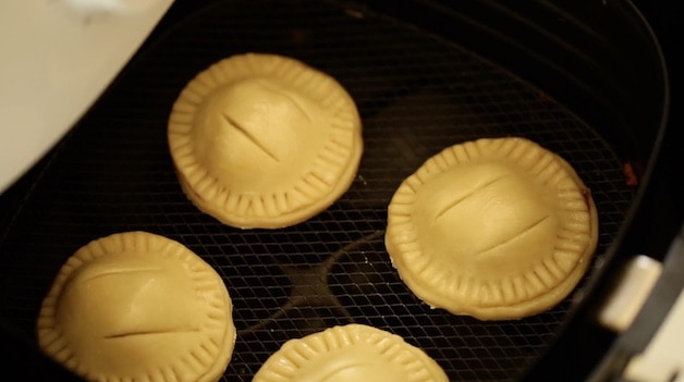 hand pies in an air fryer basket