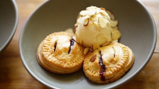 Blueberry Hand Pies in bowl with vanilla ice cream