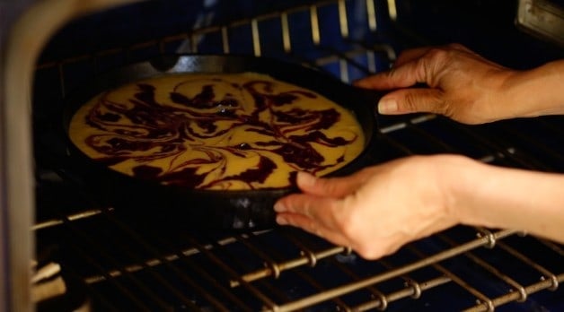 Blackberry Cornbread Sklllet placed in oven