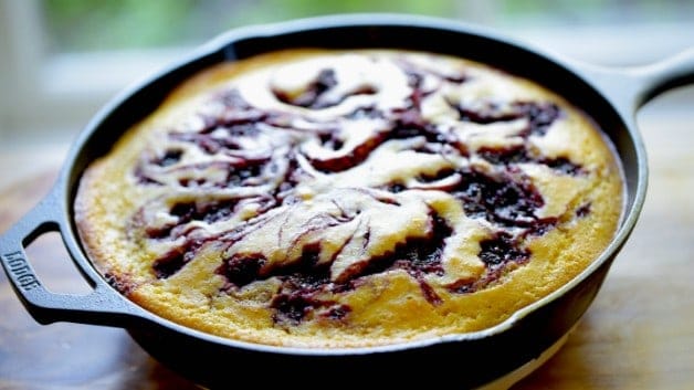 Blackberry Cornbread Skillet cake in a cast-iron skillet