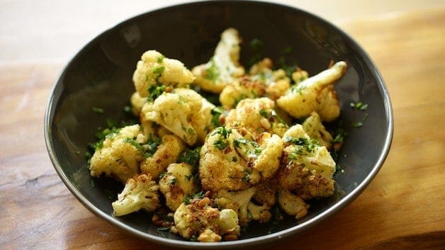 Roasted Cauliflower in a bowl with fresh parsley as a garnish