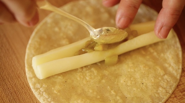 filling a cheese stick with green chiles