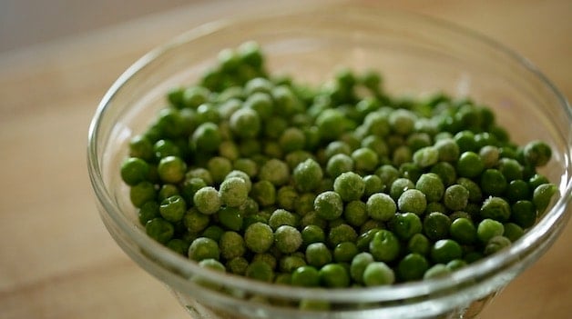 Frozen peas in a glass bowl