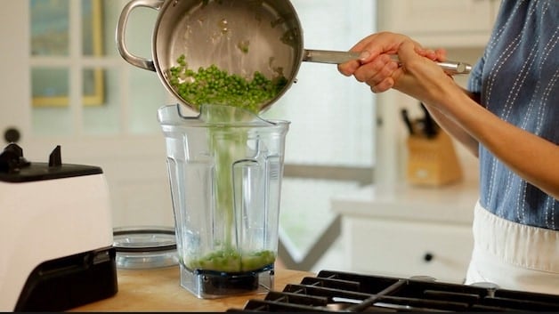 Adding simmered peas to a blender