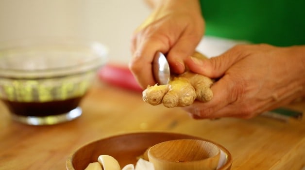 Peeling ginger with a Spoon for Salad Dressing Mixture