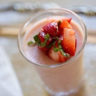  Strawberry Panna Cotta in a clear glass topped with strawberries