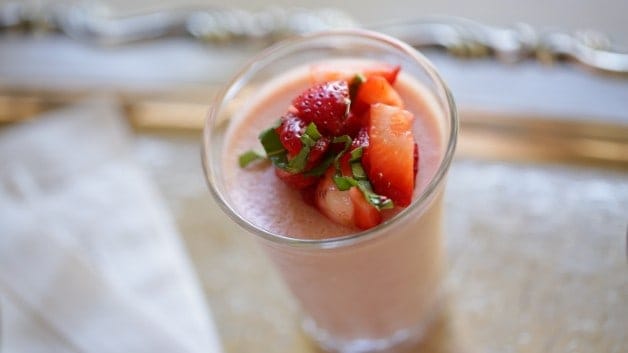  Strawberry Panna Cotta in a clear glass topped with strawberries