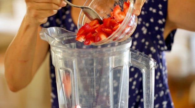 Placing Strawberries in blender