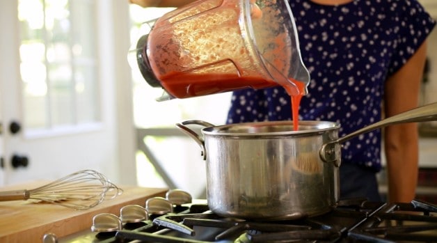 Strawberry puree poured into pot