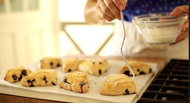 Drizzling Lemon Glaze on Lemon Blueberry scones