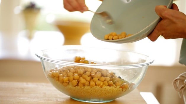 Chickpeas in bowl with couscous for salad