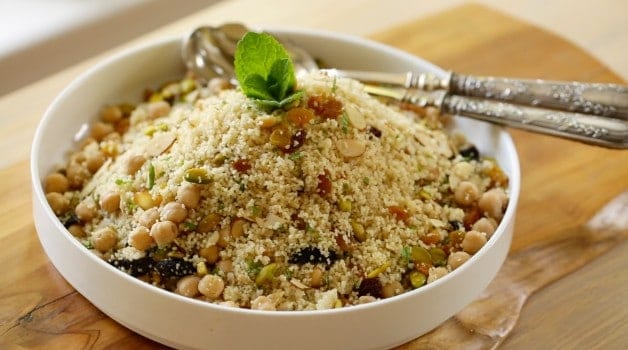 Couscous Salad in white bowl with garnish