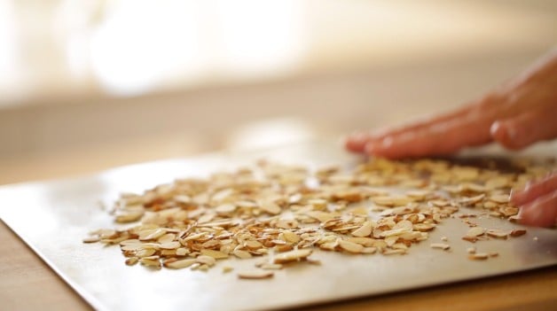 Raw almonds on a baking sheet