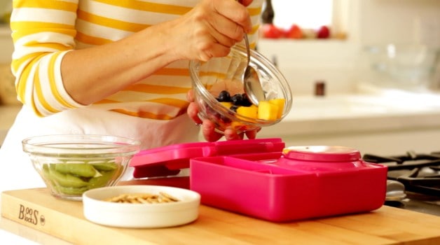 Adding fruit to Omie Lunchbox