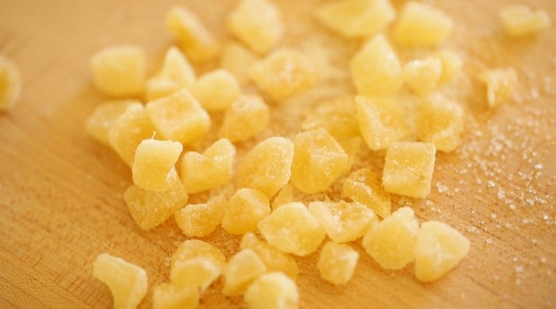 tight shot of candied ginger on a cutting board
