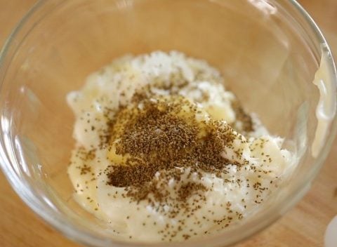 Mayonnaise, sour cream, Dijon mustard and celery salt in bowl to make traditional potato salad