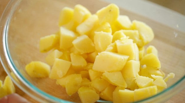 Golden Yukon Potatoes chopped into chunks in a clear bowl
