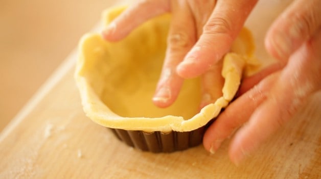 Fitting dough to tart tin for Cherry Bakewell Tart Recipe